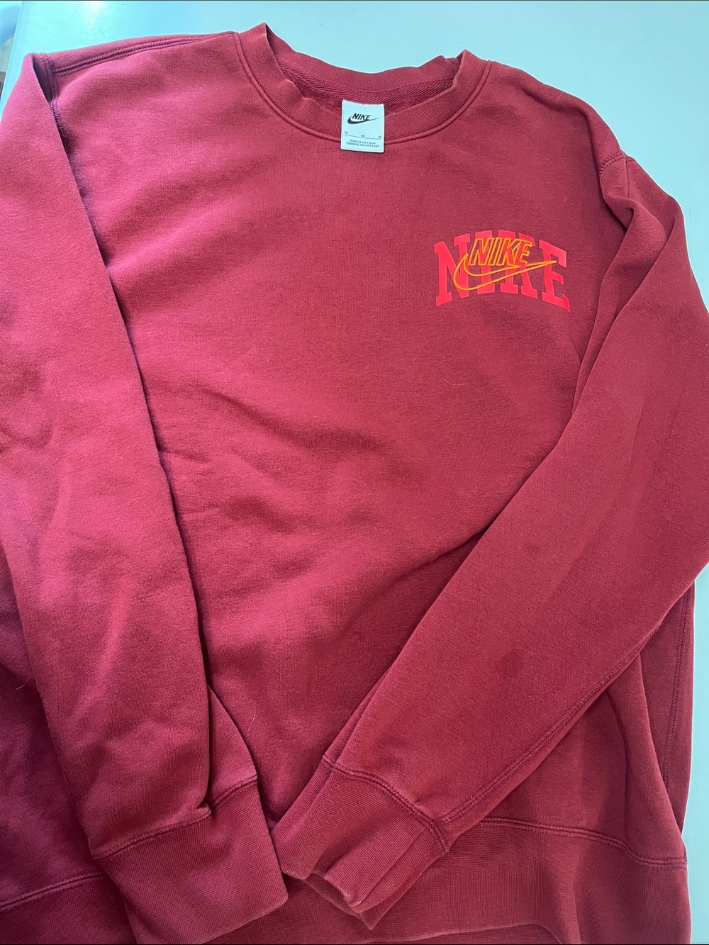 Nike Men's Burgundy Crewneck Sweatshirt with Orange Logo